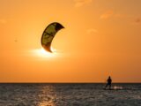 man surfing during sunset